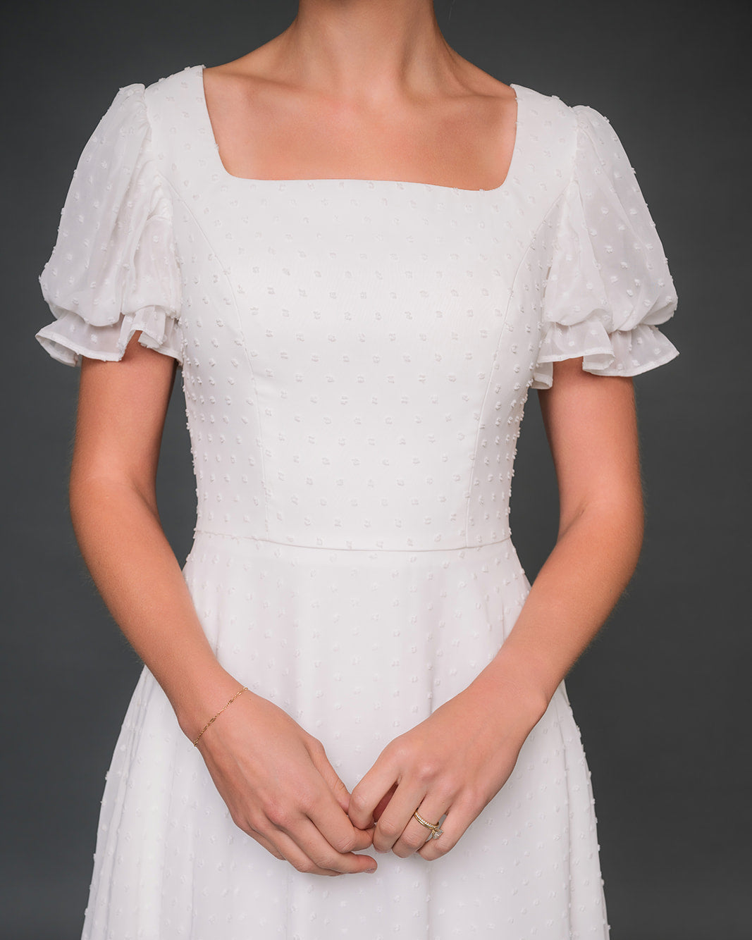 chiffon dress with ruffled sleeves on a dark background